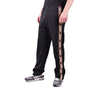 Dsquared men black cotton blend track pants with bold vertical stripe featuring white and gold brand logo lettering