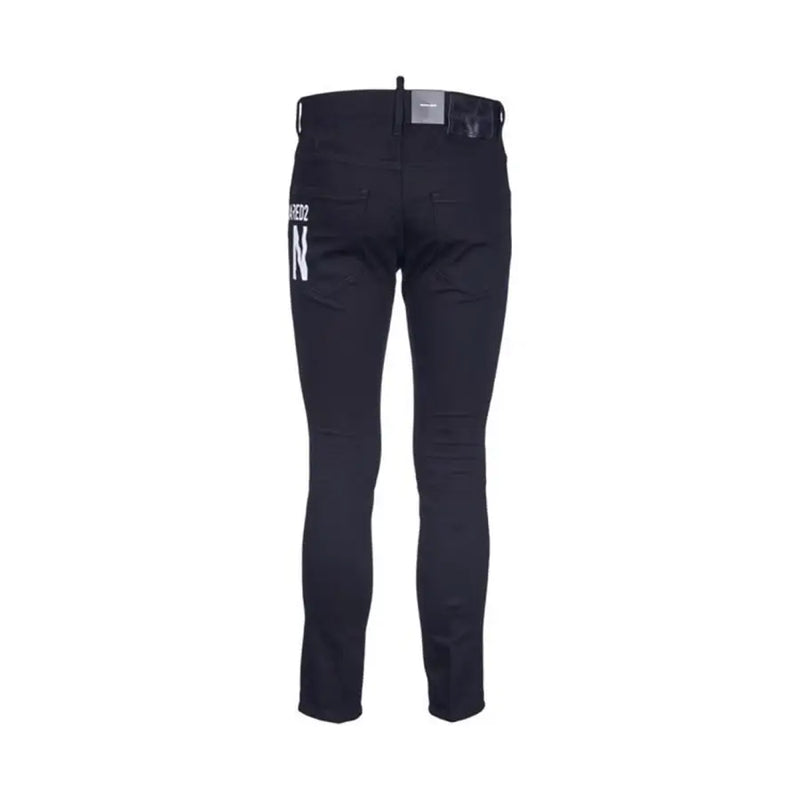 Back side of black Dsquared2 slim fit jeans with white lettering on the pocket fall winter B44373 zip and button closure