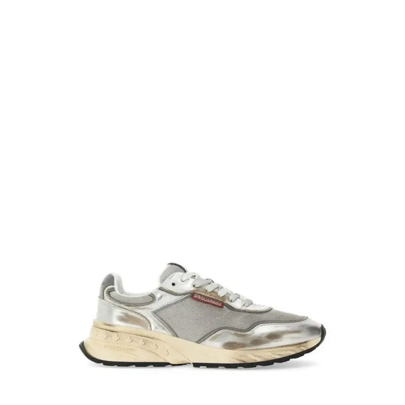 Silver metallic sneaker with mesh accents and white sole, inspired by prada’s run 100 model.