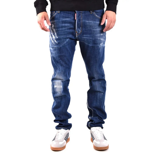 Dark blue distressed denim jeans with faded wash and rips in cotton elastane showing back with dsquared2 label