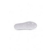 White rubber sole with textured grid and circular traction on ea7 black leather slip on sneakers for men