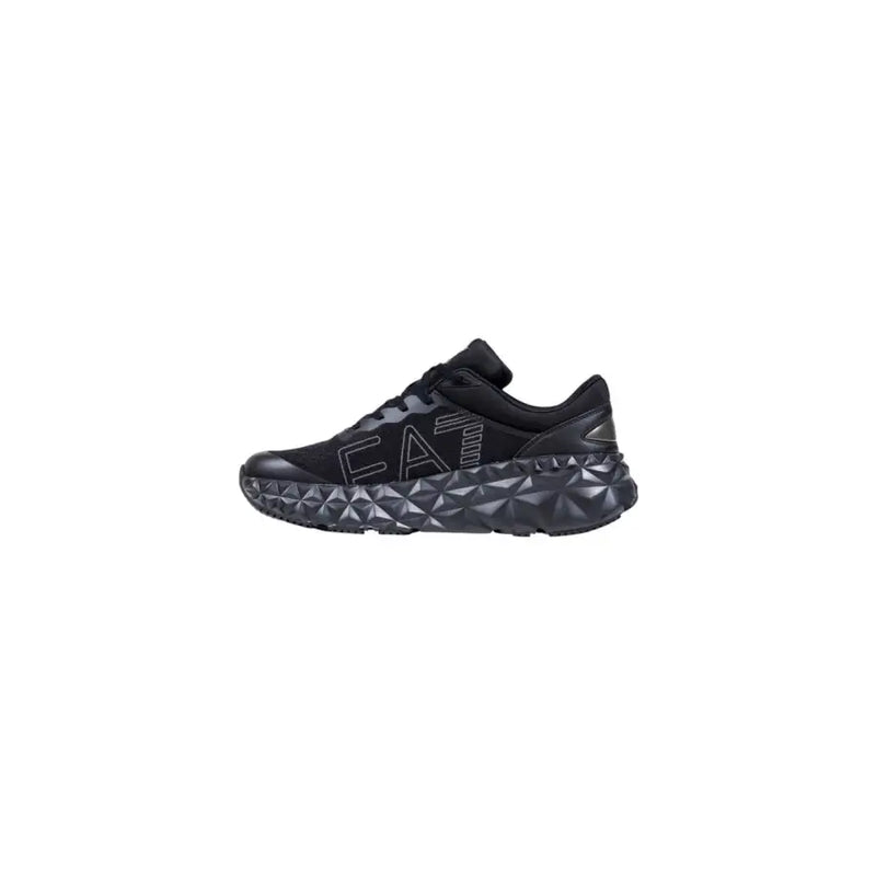 Black ea7 sneaker with textured sole and velcro strap.