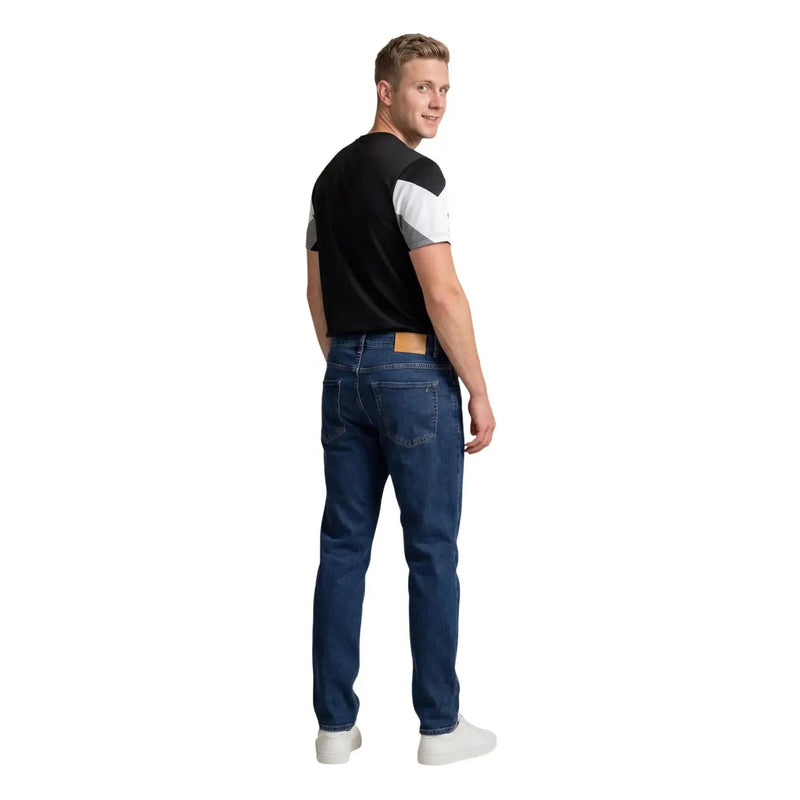 Dark blue denim jeans with classic five-pocket design and tan leather belt loop paired with Ea7 men t-shirt