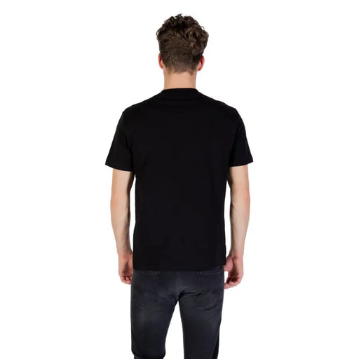 Ea7 Men black round neck cotton elastane T shirt paired with dark grey jeans