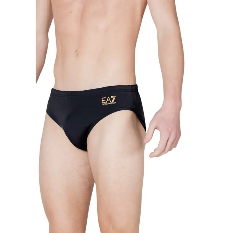 Black ea7 men swimwear swim trunks featuring gold logo detailing suitable for beach and pool use