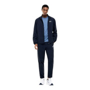 Navy blue ea7 track suit jacket with white logo detailing paired with a light blue short sleeve cotton t shirt for men