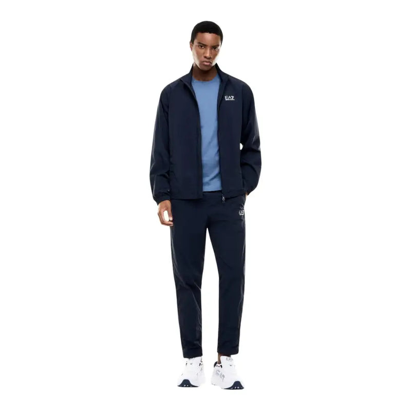 Navy blue ea7 track suit jacket with white logo detailing paired with a light blue short sleeve cotton t shirt for men
