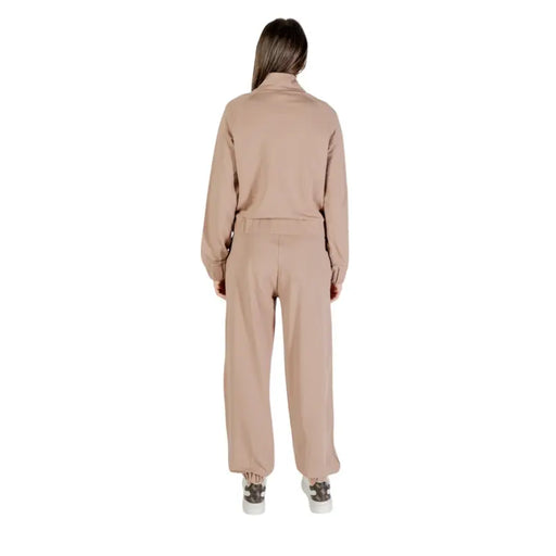 Women’s beige long-sleeved collared cotton blend jumpsuit with zip and front pockets