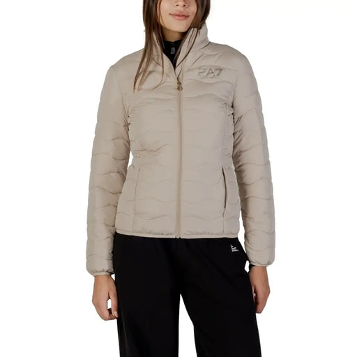 Ea7 women’s beige long turtleneck puffer jacket with quilted design, zip pockets, and subtle logo on chest