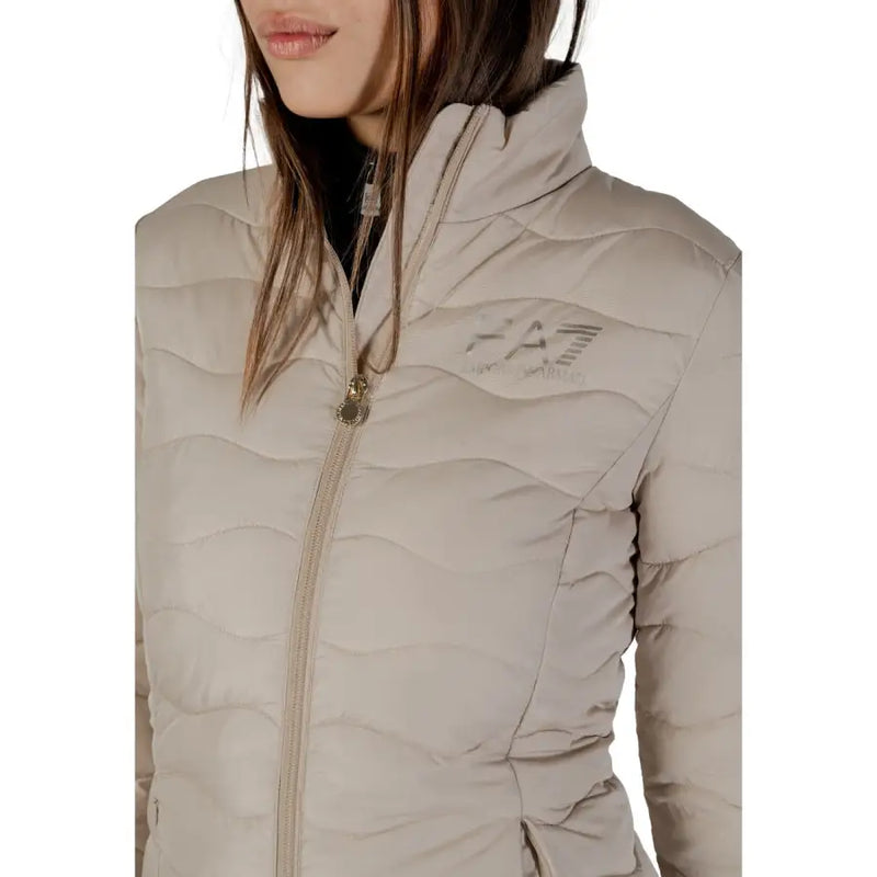 Ea7 women’s beige quilted puffer jacket with high collar, subtle logo, and zip pockets for warmth and style