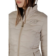 Ea7 women’s beige quilted puffer jacket with high collar, subtle logo, and zip pockets for warmth and style
