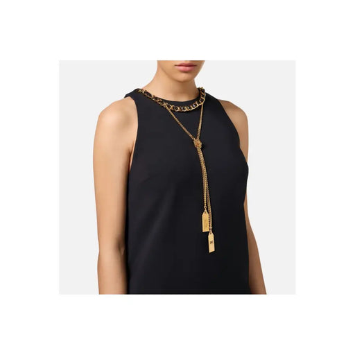 Gold-tone chain link and lariat necklace with rectangular pendants on Elisabetta Franchi blouse