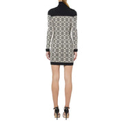 Black and white geometric knit mini dress with high neck and long sleeves by Elisabetta Franchi