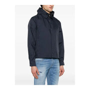 Navy blue quilted jacket with hood and zipper closure, likely made of nylon or polyester.