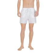 White Emporio Armani swim trunks with a drawstring waistband and subtle branding on the lower right leg for men