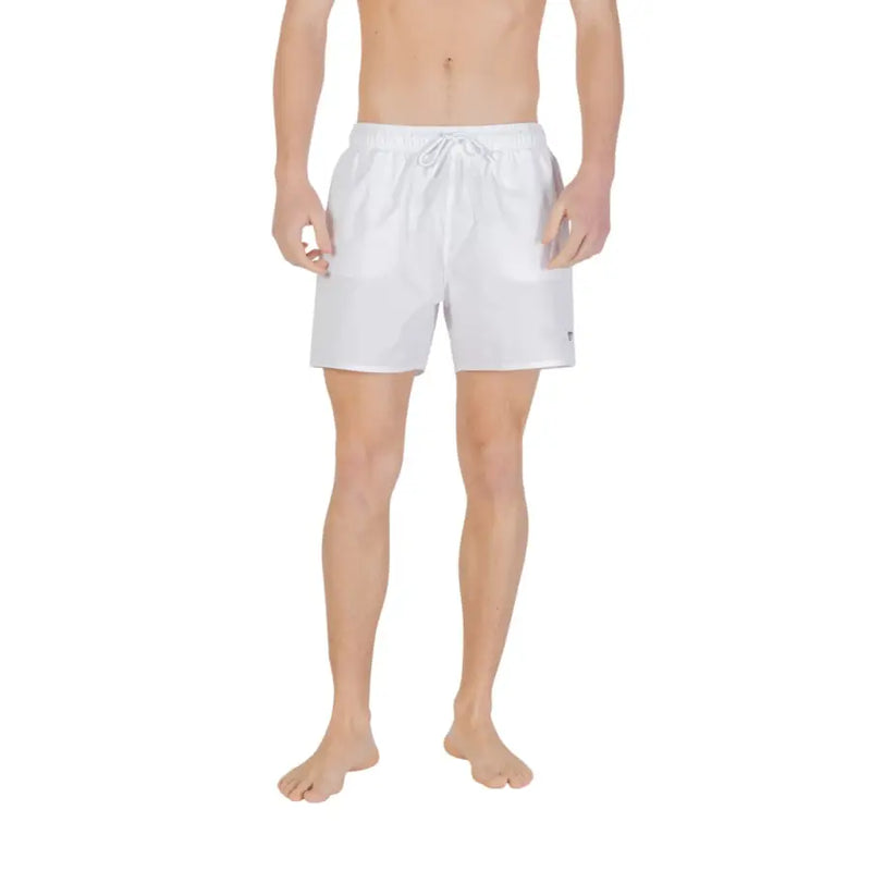 White Emporio Armani swim trunks with a drawstring waistband and subtle branding on the lower right leg for men
