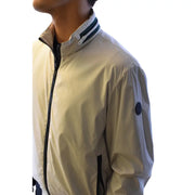 Beige lightweight bomber jacket with black zipper and trim and navy blue patch on sleeve by Fay Men Blazer