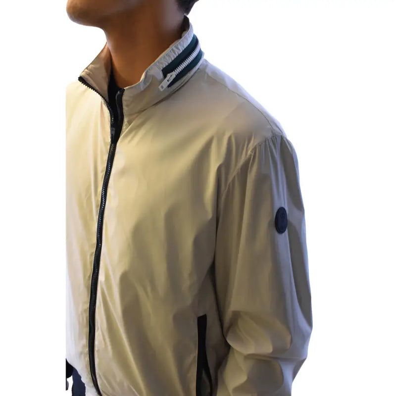 Beige lightweight bomber jacket with black zipper and trim and navy blue patch on sleeve by Fay Men Blazer