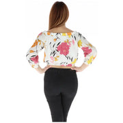 Floral off-the-shoulder crop top paired with black pants for stylish summer attire