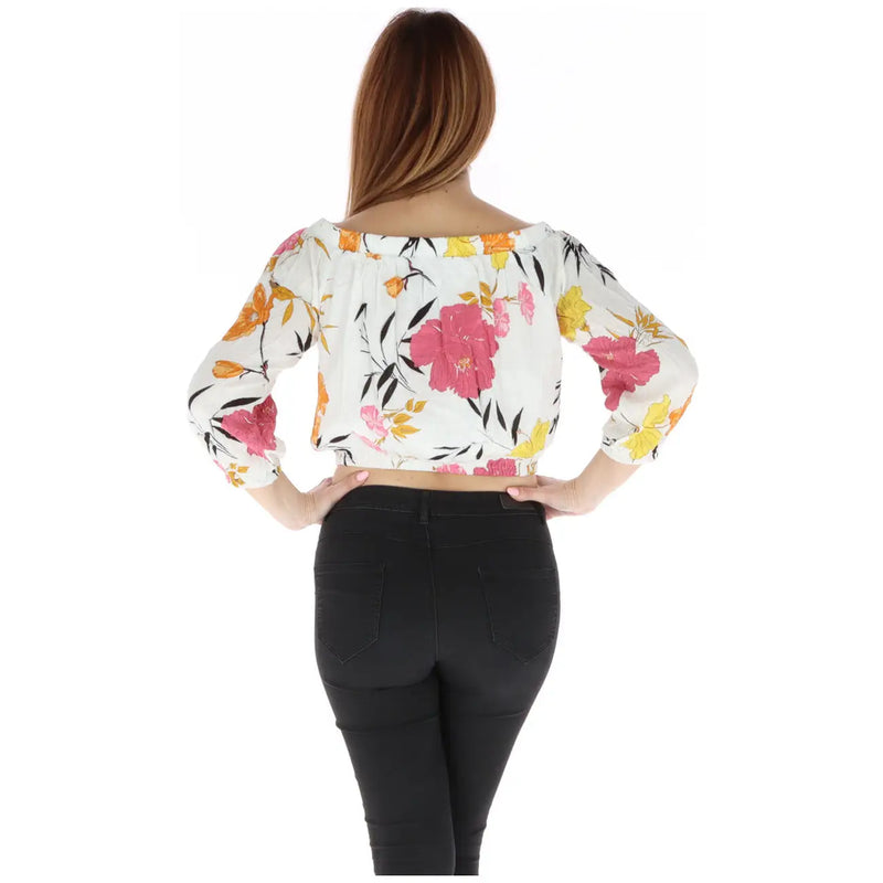 White floral off the shoulder crop top with vibrant pink yellow and orange print on flowing fabric