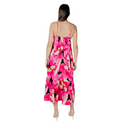 A vibrant fuchsia floral v-neck maxi dress with thin straps and tiered layers perfect for summer occasions