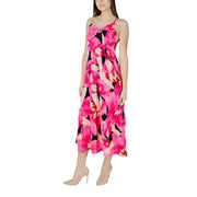 Fuchsia floral v-neck dress with straps featuring a vibrant pink floral maxi design with black and cream tiered skirt