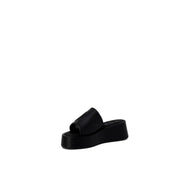 Furla women’s black leather platform slide sandal with a sleek minimalist design and smooth leather-like finish