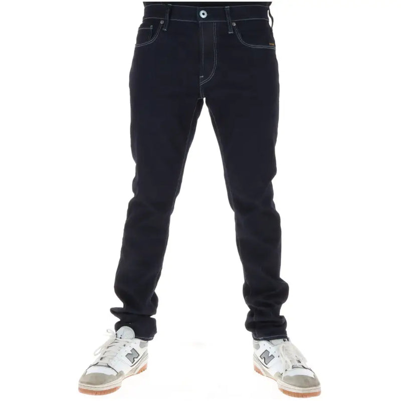 Dark indigo cotton stretch G-star men jeans with contrasting white stitching and classic five-pocket design button fly