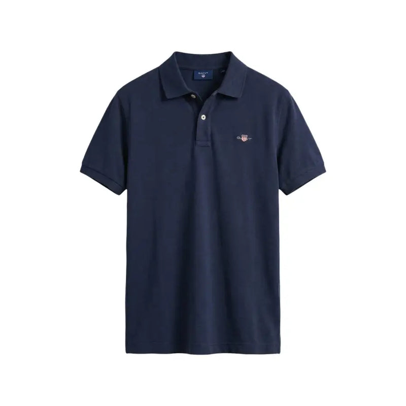 Navy blue Gant men polo shirt with buttoned collar short sleeve cotton pique and small embroidered logo on left chest