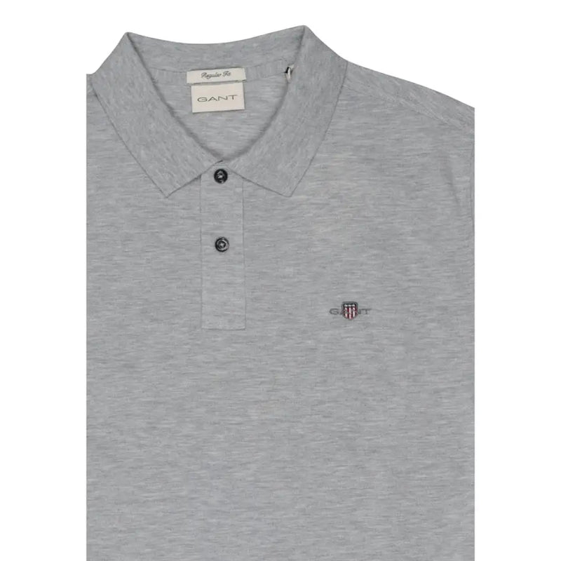Gray heathered gant men polo shirt with classic collar, button placket, cotton stretch, short sleeve, and embroidered shield logo