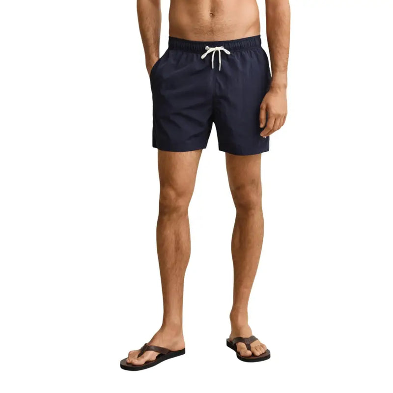Navy blue Gant men swimwear swim trunks with white drawstring designed for comfortable beachwear use