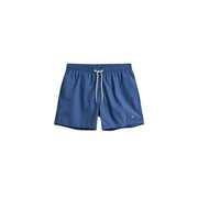 Hellblaue Polyamid-Badeshorts von Gant für Herren mit weißen Kordelzügen und einem kleinen Logo am rechten Bein.