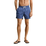 Blue swim trunks by Gant for men featuring a white drawstring waistband ideal for swimwear use