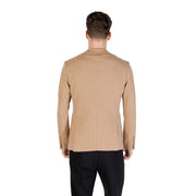 Men’s tan blazer paired with black trousers from Gianni Lupo Beige Spring Summer collection
