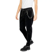 Men’s black velvet drawstring cargo trousers with silver wallet chain and black lace-up shoes