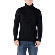 Black cable knit turtleneck sweater with a classic design and ribbed cuffs, collar, and hem.