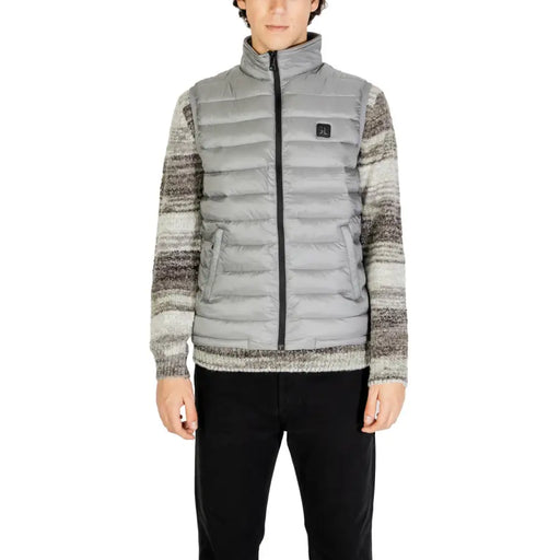 Grey and white patterned down jacket with zipper closure.