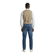 Beige cotton stretch waistcoat with belt detail by Gianni Lupo worn over white shirt and paired with blue jeans
