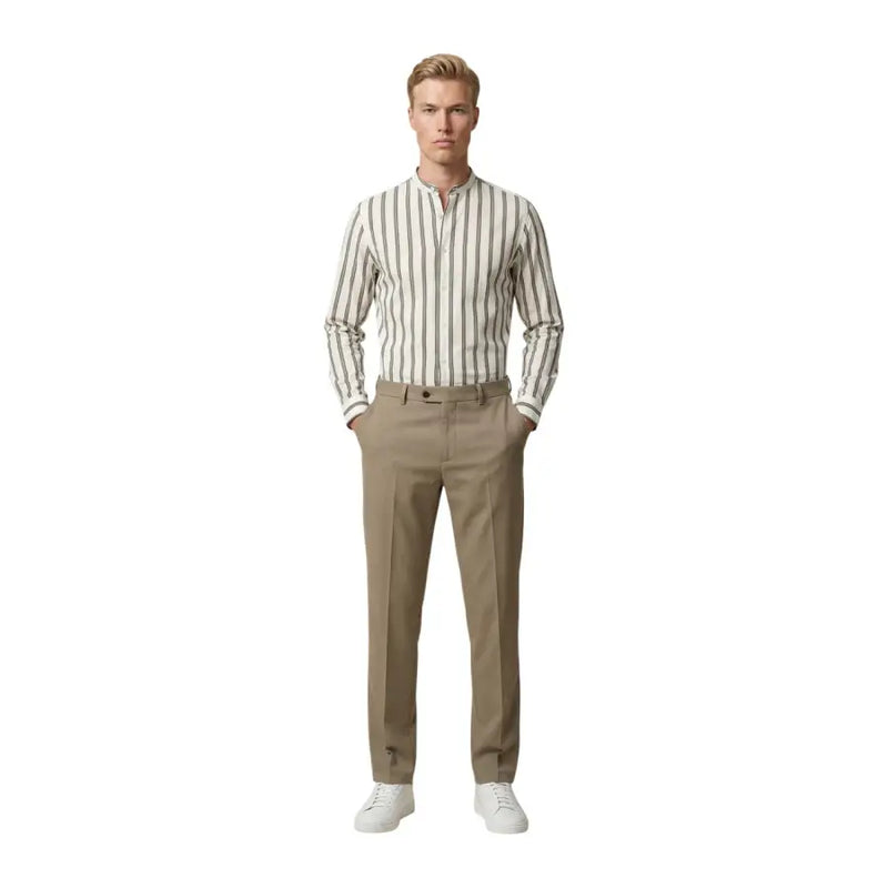 A man wearing a gianni lupo men shirt with cream and dark gray vertical stripes and long sleeves