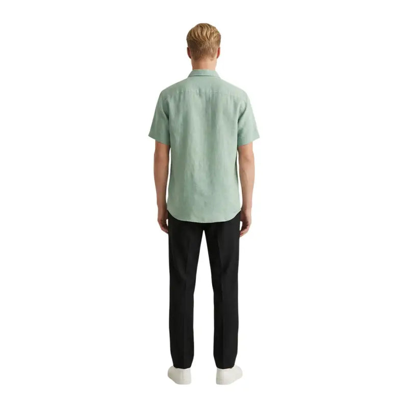 Gianni Lupo men shirt light green short-sleeved button-up made of textured fabric worn with black trousers