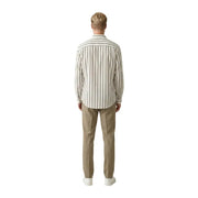 A man wearing a beige and dark gray vertically striped long-sleeved button-down Gianni Lupo men shirt