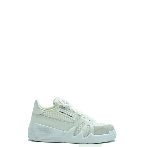 White puma sneakers with mesh accents and chunky sole.