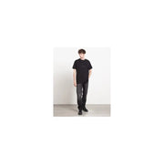 Black short-sleeved t-shirt with minimalist chest logo paired with Givenchy men grey cotton jeans size IT 44