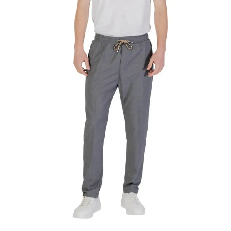 Gray drawstring pants displayed with Gianni Lupo Men’s Beige Trousers with Pockets
