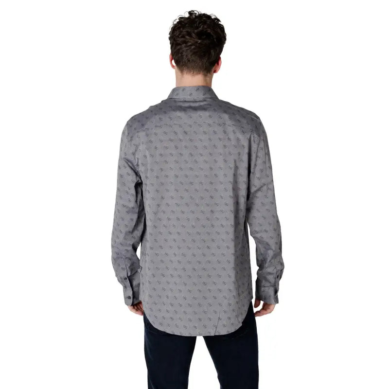 Gray patterned men’s long sleeved shirt featuring a subtle repeating pattern of small dark gray abstract shapes