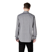 Gray patterned men’s long sleeved shirt with a subtle repeating pattern of small dark motifs on button-down fabric
