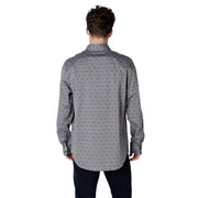 Gray patterned men’s long sleeved shirt featuring a subtle repeating pattern of small dark gray abstract shapes