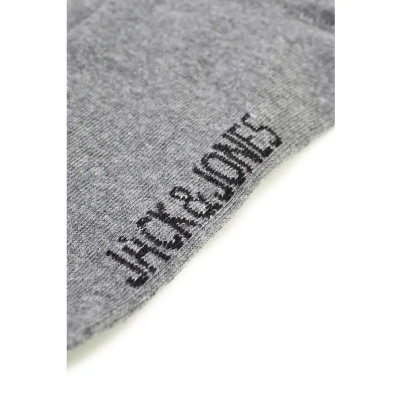 Gray cotton sock displaying brand name for comfortable everyday wear