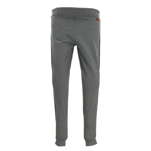 Gray heathered jogger pants with black side stripes and a small brown brand tag on the waistband