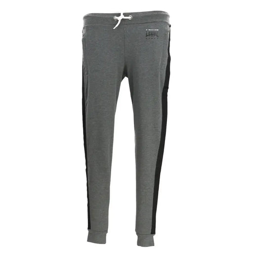 Gray heathered sweatpants with black side stripes and a white drawstring made of soft jogger material